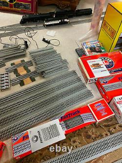 LIONEL O Scale Fastrack Train collection. 2 beautiful engines, cars, buidings, etc