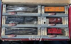 Vintage Gilbert HO train set with steam engine, 3 cars, and track. DC. #HO-320