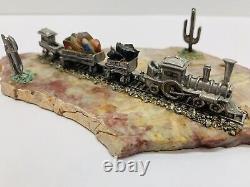 Vieux Train Miniature D'étain Avec Piste Diorama Sur Le Rocher